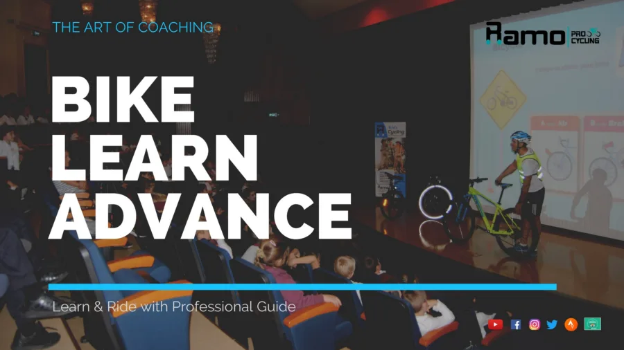 Poster: a talk in a school hall with a bike on stage and a road-signs slide, captioned THE ART OF COACHING, BIKE LEARN ADVANCE, Learn & Ride with Professional Guide