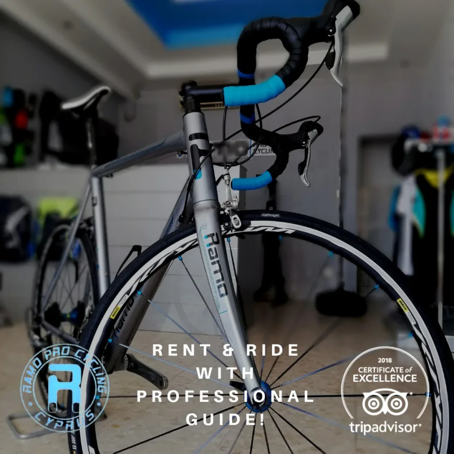 Poster: a silver road bike in the shop with blue bar tape, captioned RENT & RIDE WITH PROFESSIONAL GUIDE! beside a 2018 TripAdvisor Certificate of Excellence