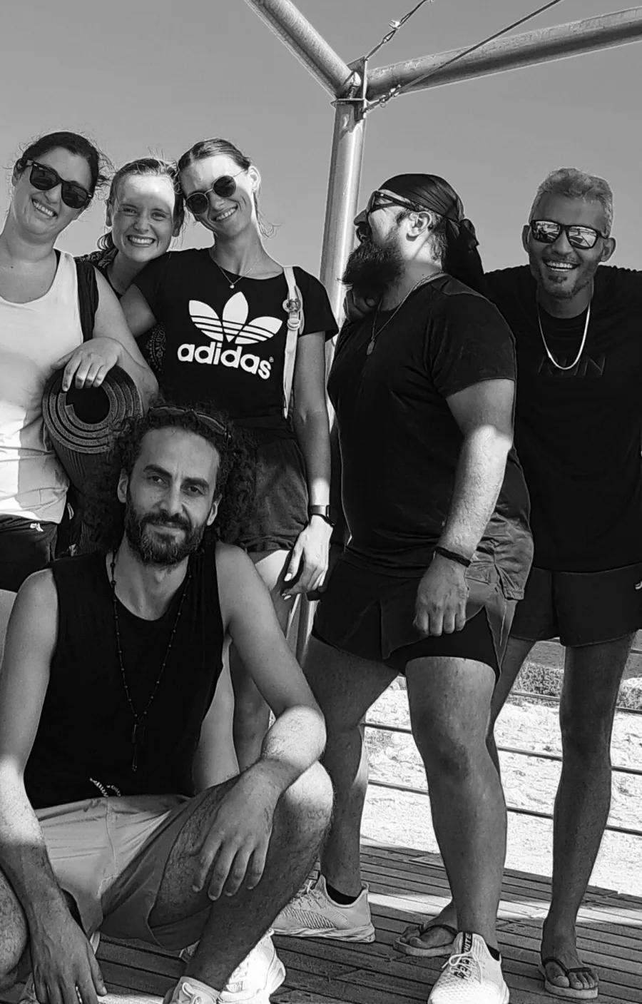 Black and white group portrait of six people after a morning session