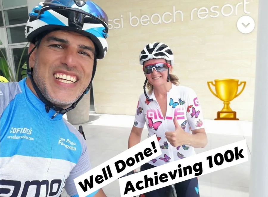A shared story: a coach and a rider outside a beach resort, captioned Well Done! Achieving 100k
