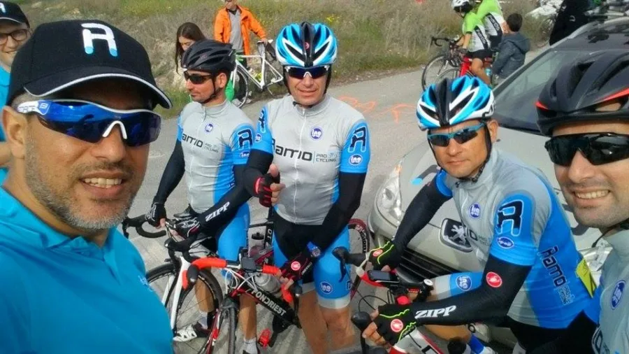 A selfie of several riders in Ramo kit with their bikes on a road