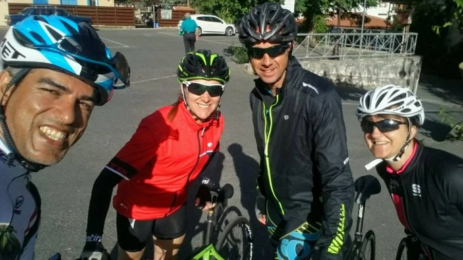 Riders standing together with their bikes at the roadside