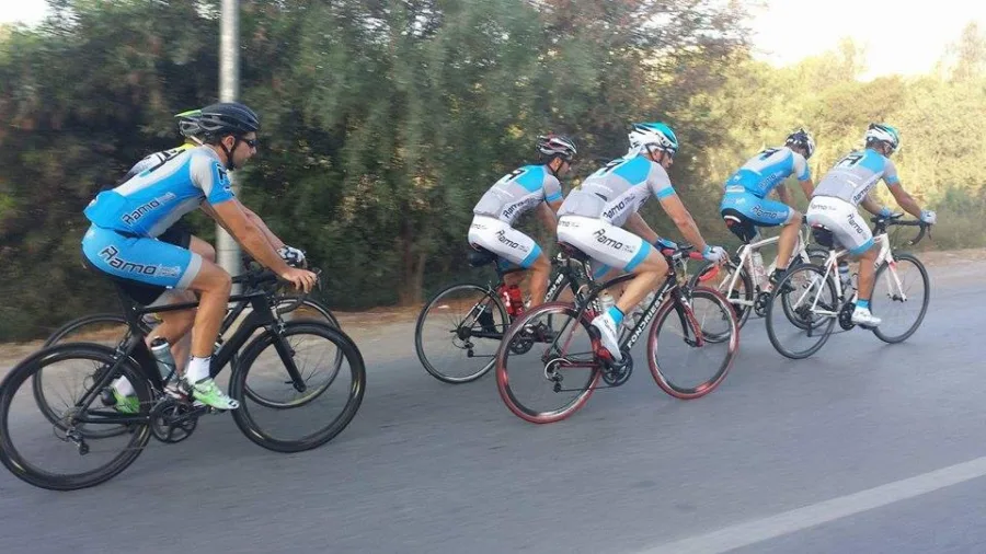 Riders in Ramo kit riding together on a road