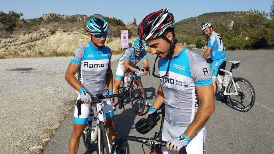 Riders in Ramo kit with their bikes on a gravel track