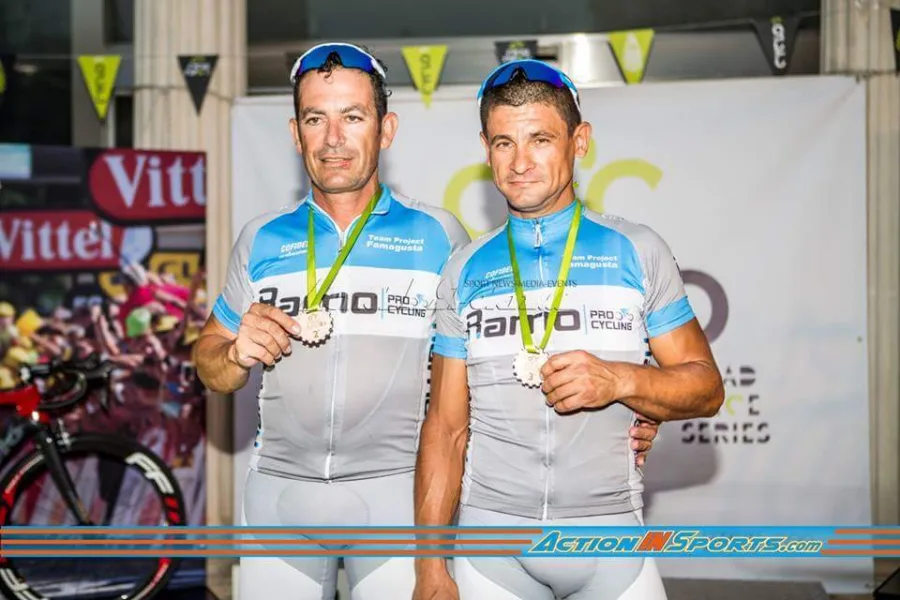 Two riders in Ramo kit wearing medals at a race finish