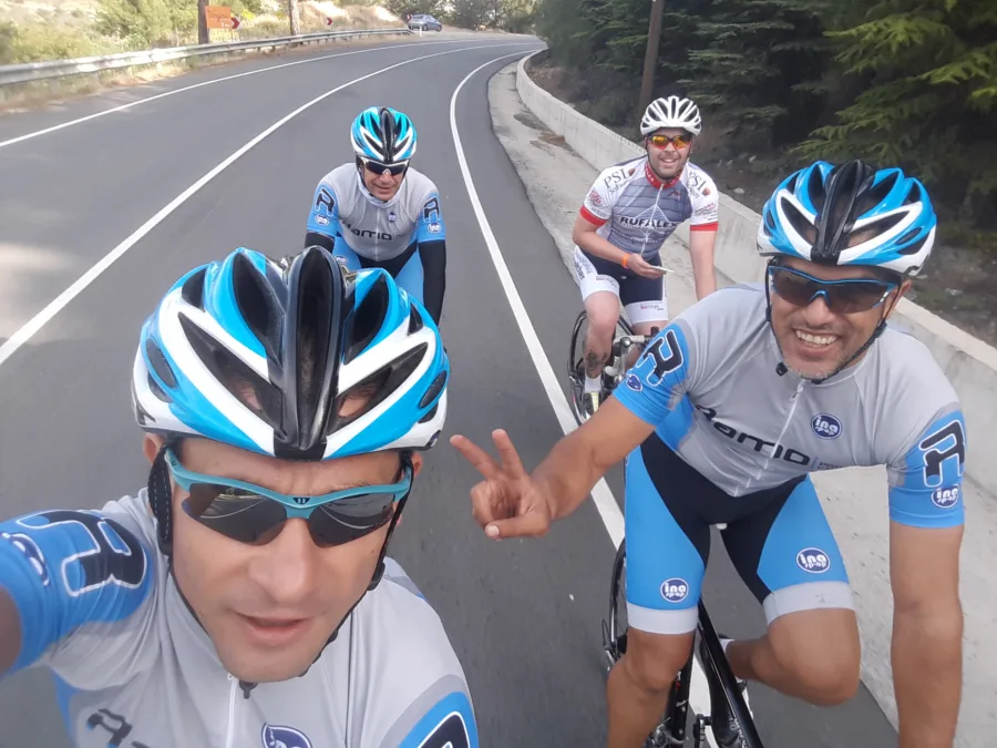 A selfie of two riders in Ramo kit on a mountain road
