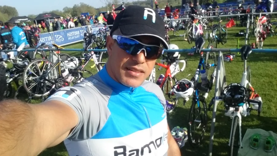 A selfie in a transition area filled with racked bikes