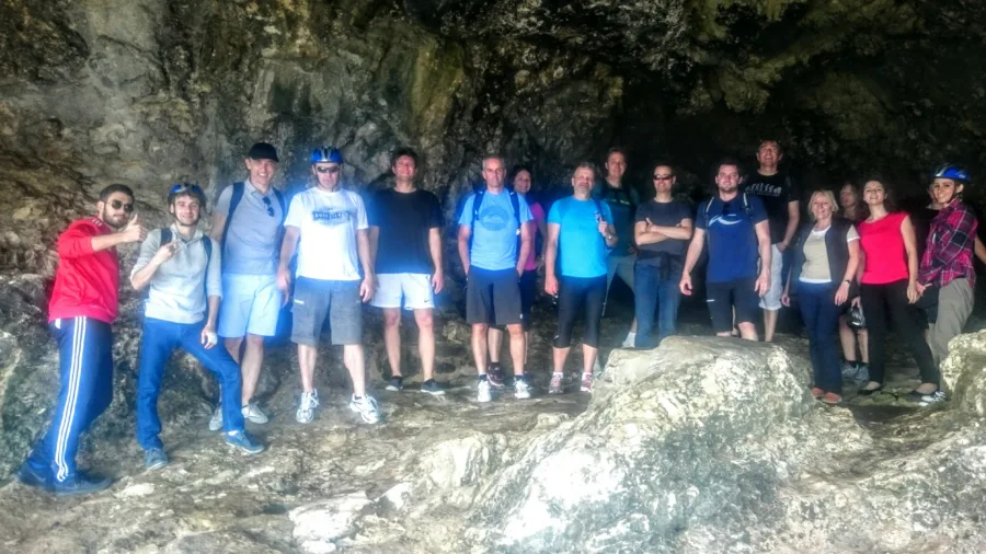 A group standing together on rocks after a ride