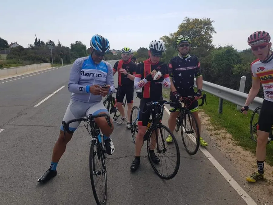 Riders stopped on a road during a training camp