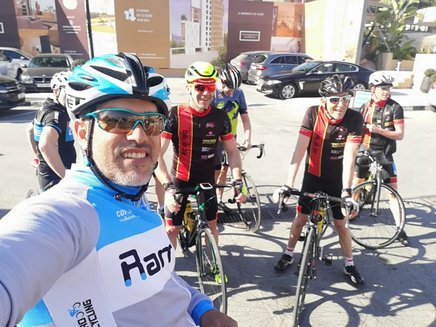 A selfie with a large group of riders in kit before a ride
