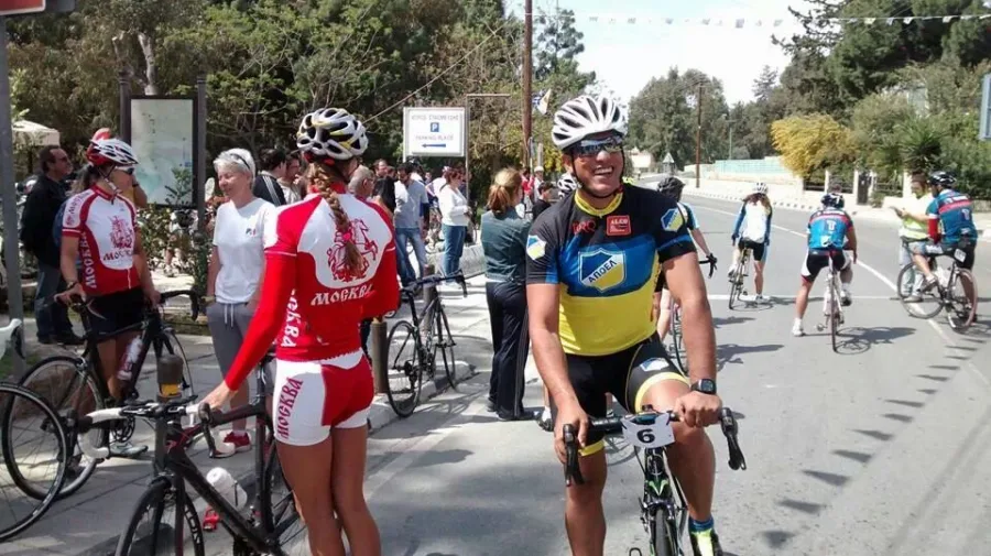 Riders and spectators gathered at a roadside during an event