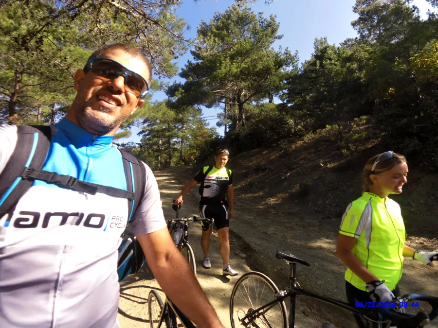 A selfie with riders stopped on a forest track