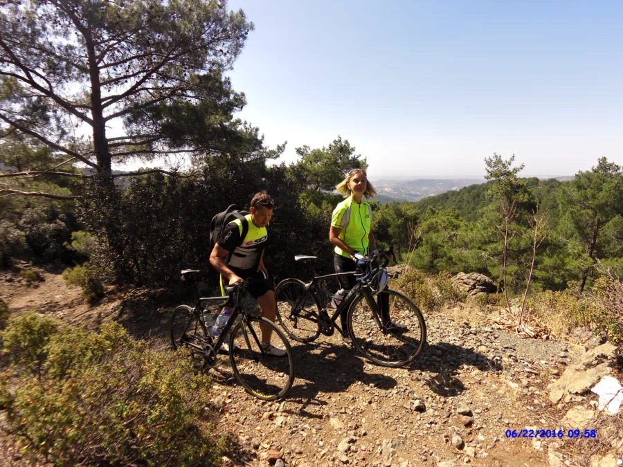 Riders with mountain bikes on a rocky track deep in the forest