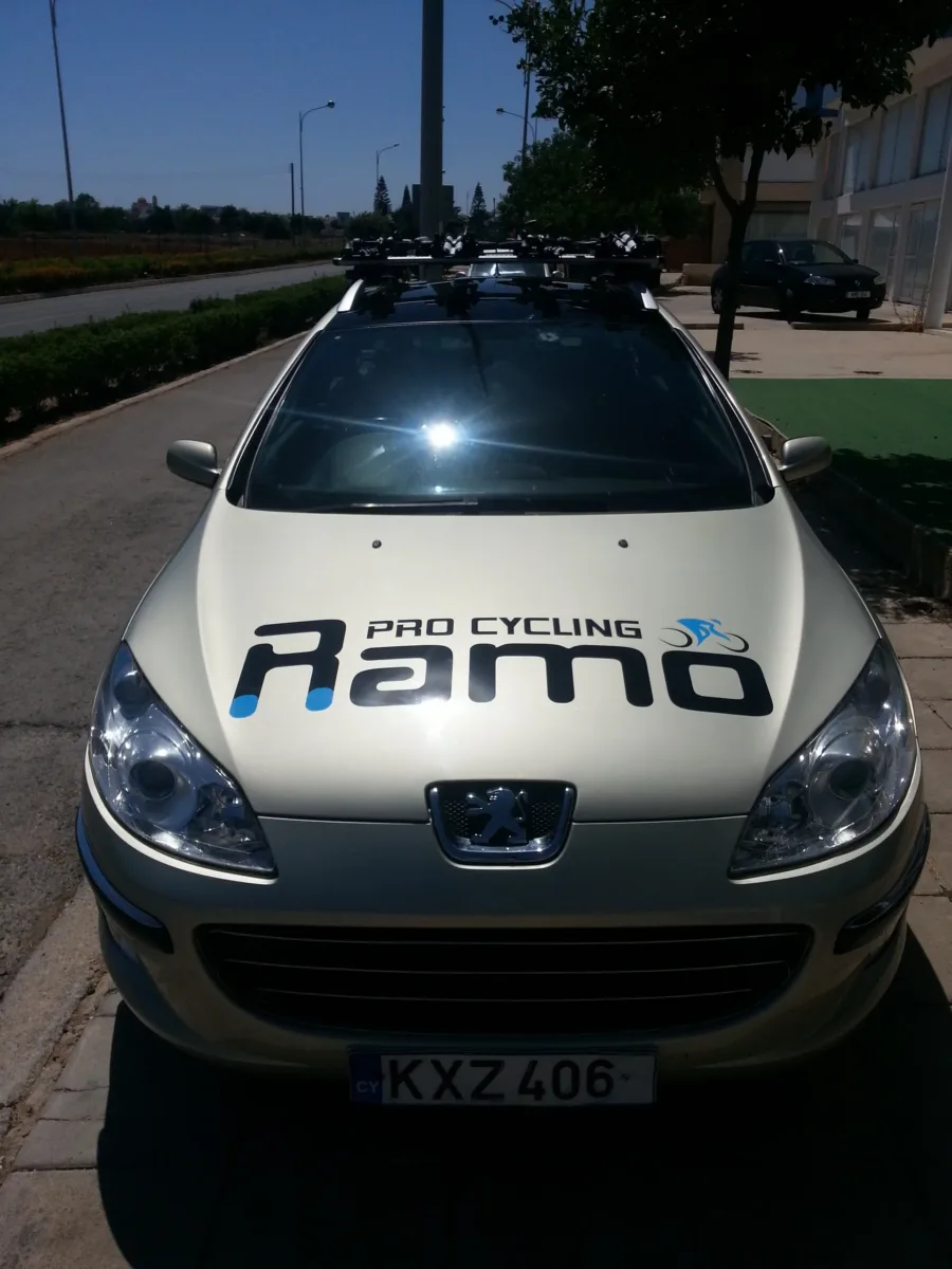 The front of the silver Ramo Pro Cycling estate car, the logo across the bonnet